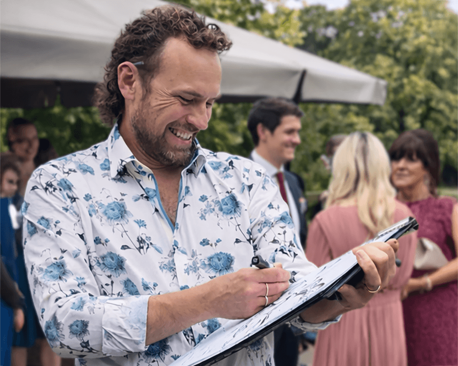 Christian Marshall caricature artist drawing guests at a live event in the UK
