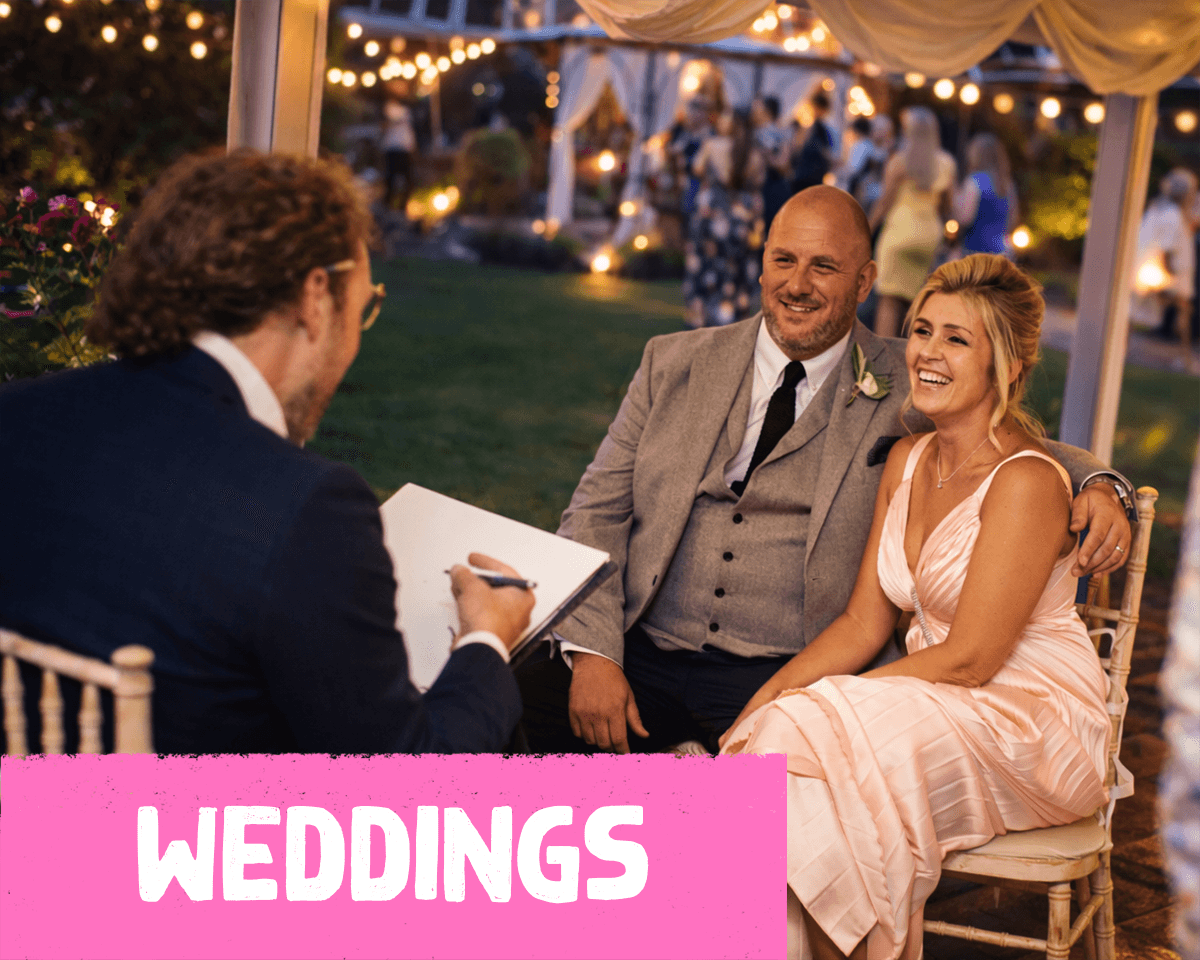Wedding caricature artist drawing guests live during a wedding reception in south west england