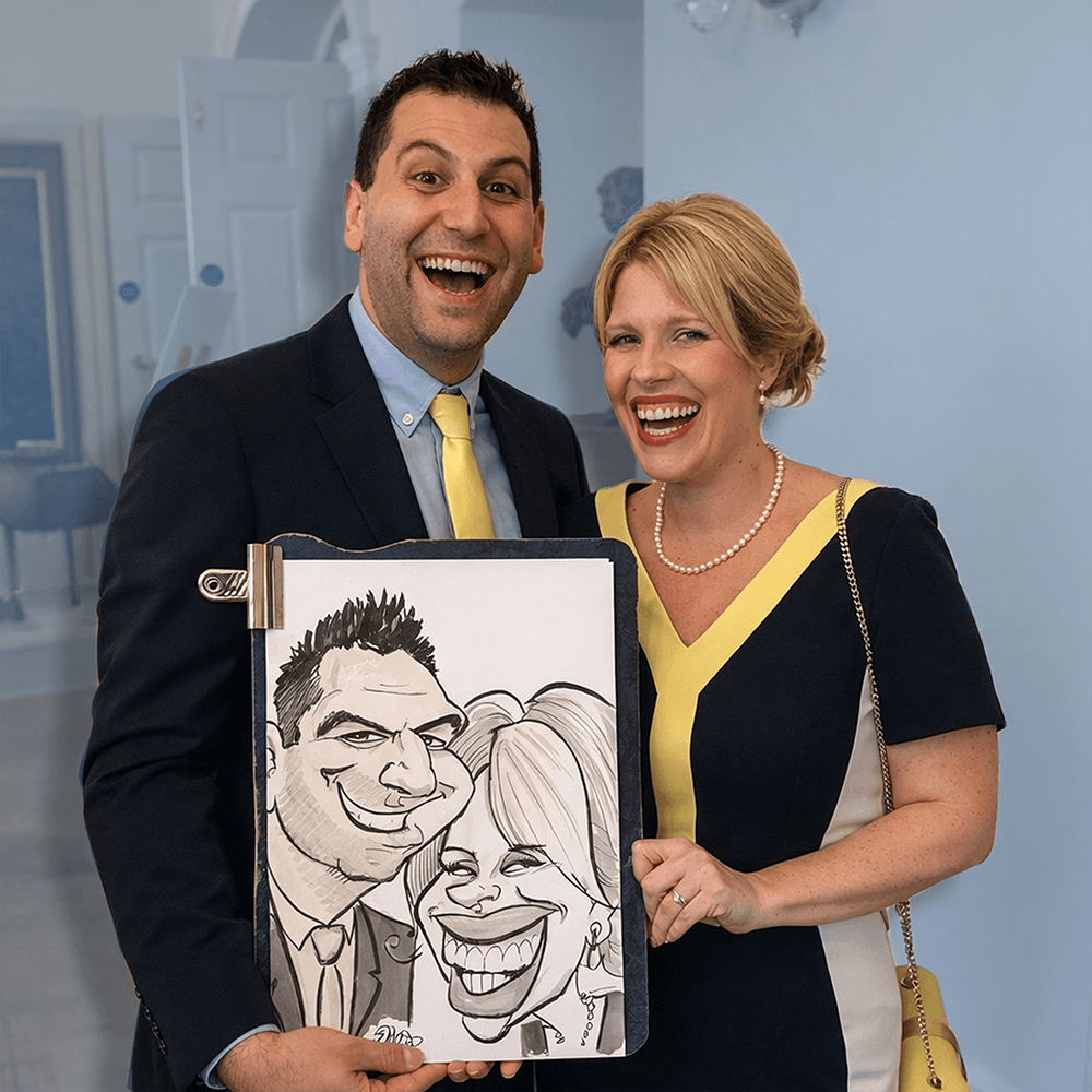 Wedding guests laughing with caricature