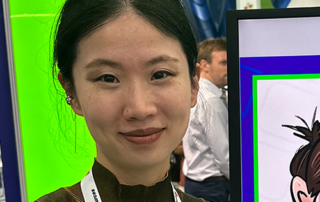 Live-event-caricatures-at-trade-show-Europe-events-S Live iPad caricature drawing displayed on screen at exhibition stand
