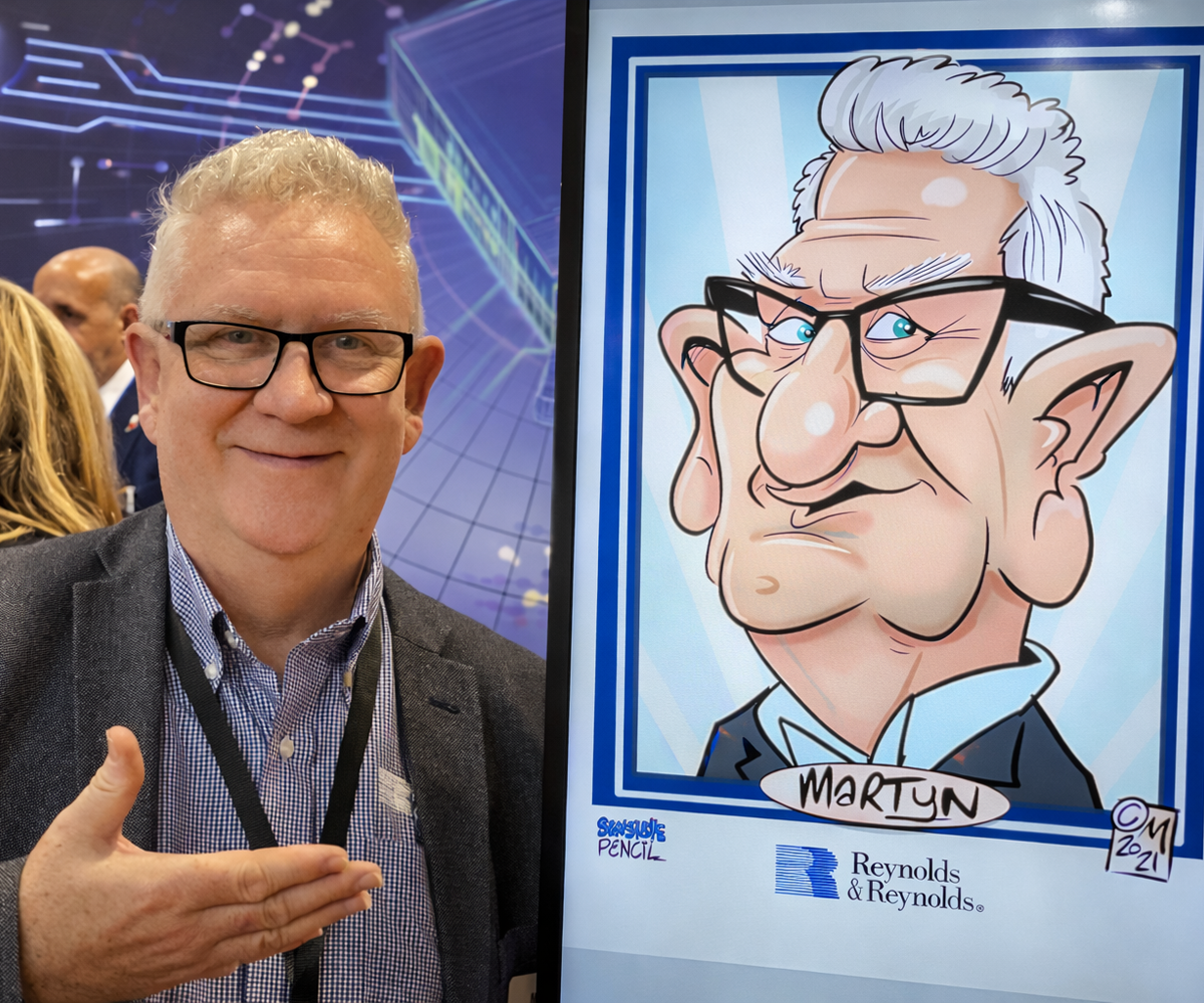 Trade-show-activation-to-attract-customers-to-stand Digital caricature artist drawing visitors live on iPad at busy trade show stand