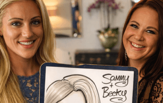 Two beautiful girls holding wedding caricature