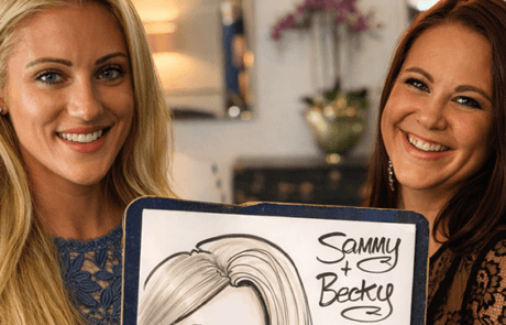 Two-women-holding-wedding-caricature-S Two beautiful girls holding wedding caricature