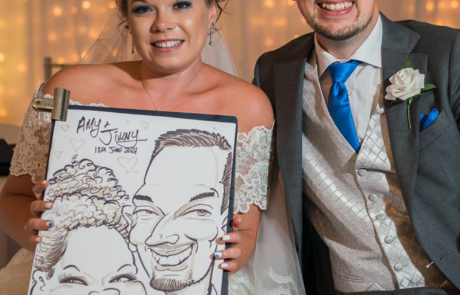 Bride and Groom hiding their caricature drawn live at a wedding evening party