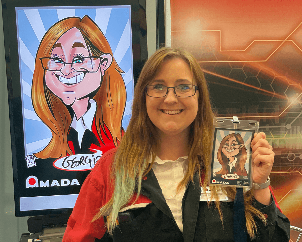 woman showing her digital caricature at trade show