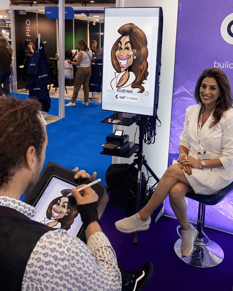 Lady with big screen TV and caricature display