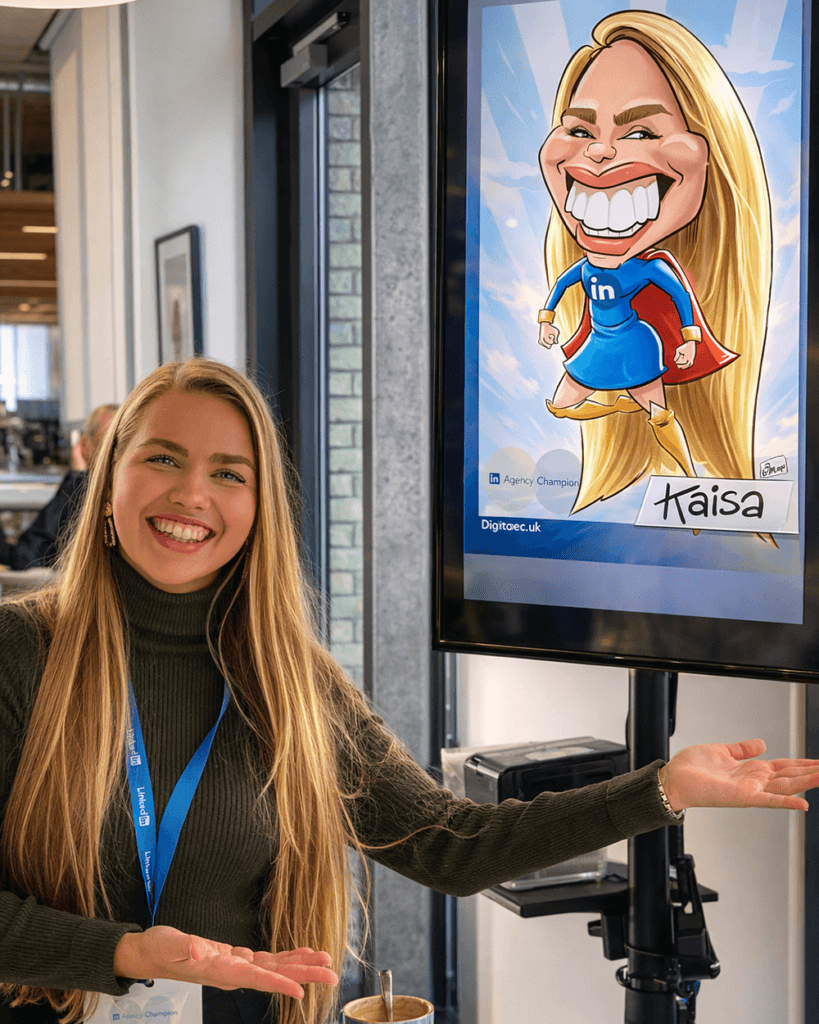 Delegate with her super hero themed caricature on large screen display