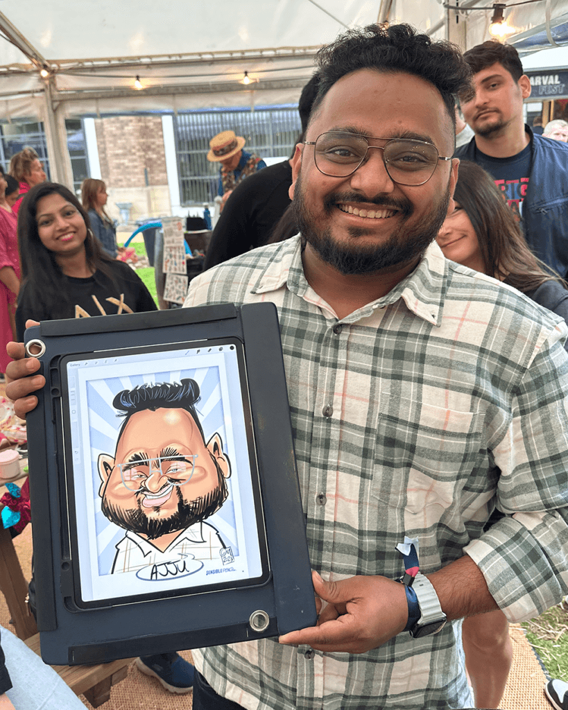 man holding iPad showing his digital caricature