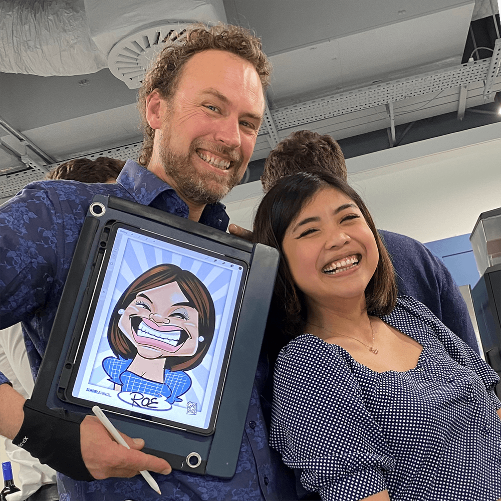 iPad-caricaturist-with-happy-guest-and-caricature-SQ Digital Caricaturist Christian Marshall with happy guest and her portrait square
