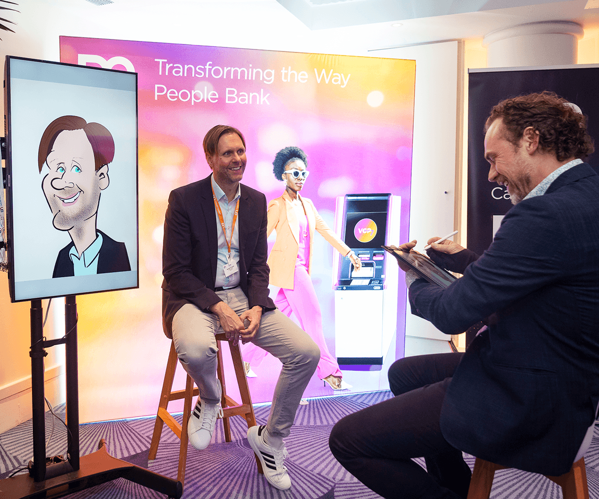 digital caricaturist drawing at conference event with big screen