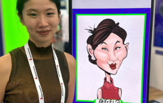 Angela-at-Viridien-booth-SC24-S Delegate with her digital caricature at SuperComputer