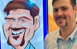 JM-with-his-caricature-at-SAP-event-S Conference booth entertainment London