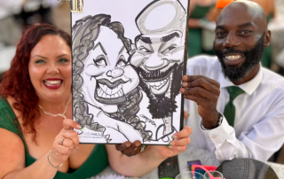 Couple with their wedding caricature in Cardiff