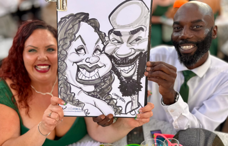 Couple with their wedding caricature in Cardiff