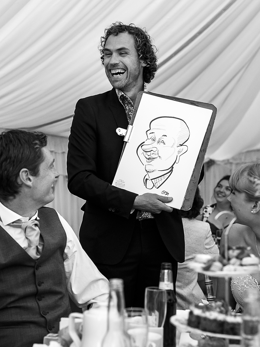 Wedding-caricaturist-Chrissy-Marshall-drawing-at-a-wedding-UK